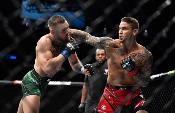 Dustin Poirier punches Conor McGregor of Ireland during the UFC 264 event at T-Mobile Arena on July 10, 2021 in Las Vegas, Nevada. (Photo by Chris Unger/Zuffa LLC)